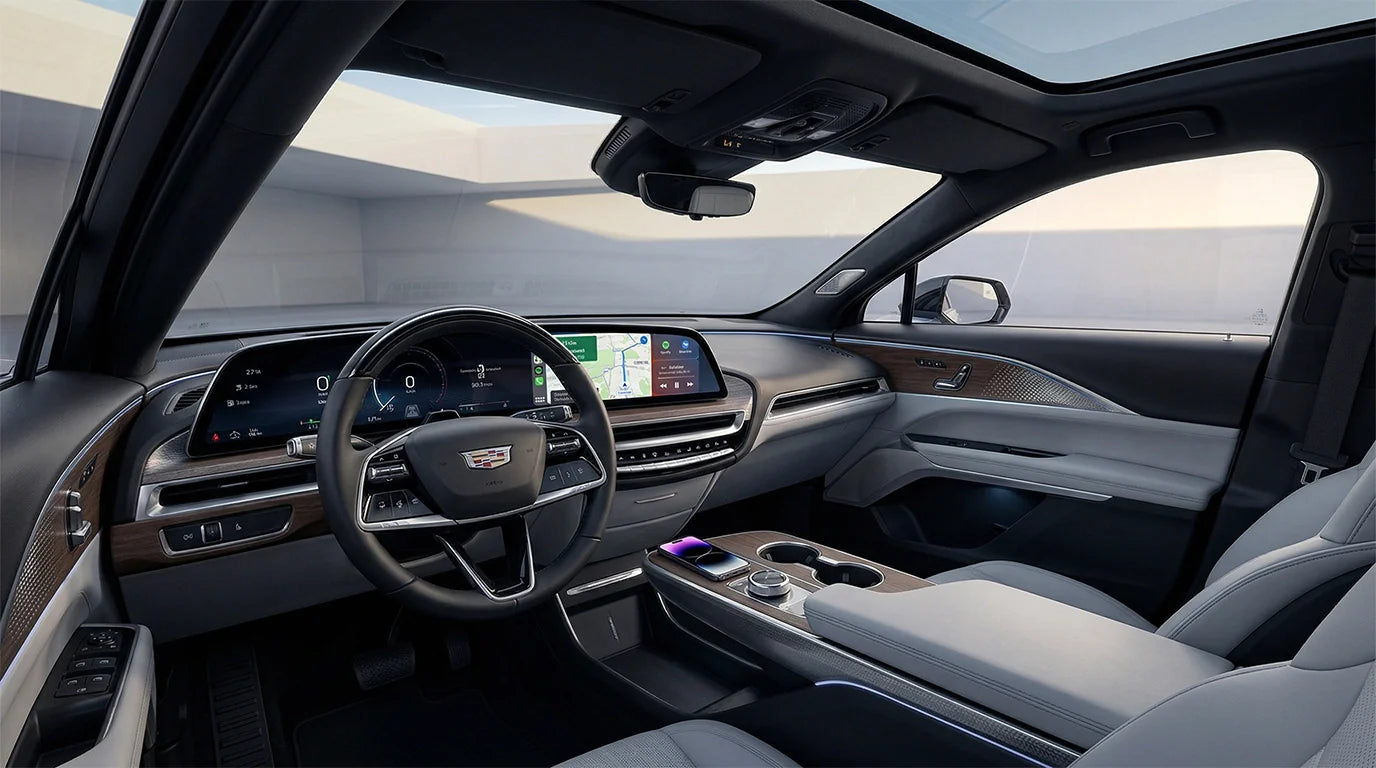Cadillac Lyriq interior with 33-inch LED display running Apple CarPlay and wireless charging pad