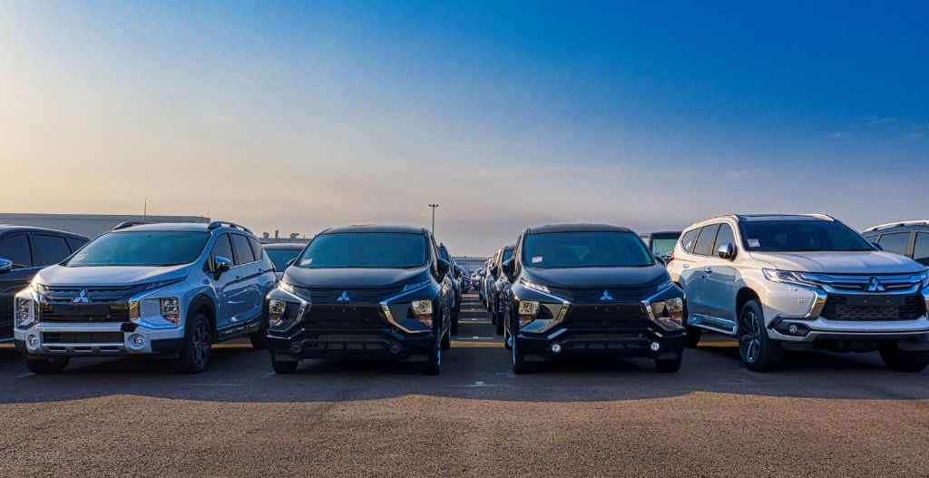 Modern SUV cars parked in row