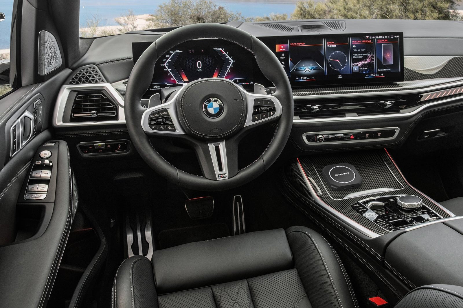 Point of view of the driver seat seeing the car dashboard.