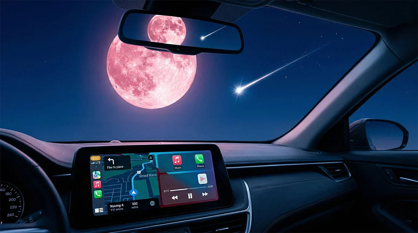 Wireless CarPlay adapter navigation screen on car dashboard under Pink Moon and Lyrid meteor shower night sky.